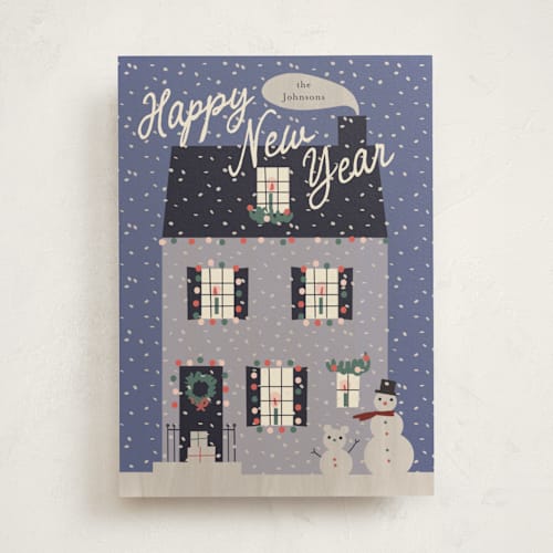 This is a violet non photo holiday cards with standard by Ani Somi called cozy house printing on signature in standard