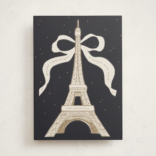 This is a champagne non photo holiday cards with standard by Gwen Bedat called eiffel printing on signature in standard