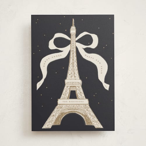 This is a champagne non photo holiday cards with standard by Gwen Bedat called eiffel printing on signature in standard