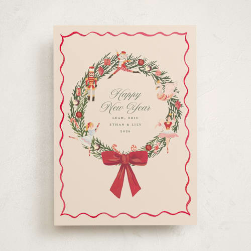 This is a berry non photo holiday cards with standard by Teju Reval called nutcracker wreath printing on signature in standard