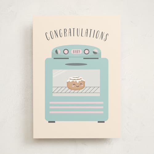 This is a beige new baby greeting cards with standard by Annie Holmquist called bun in the oven printing on signature in greeting cards