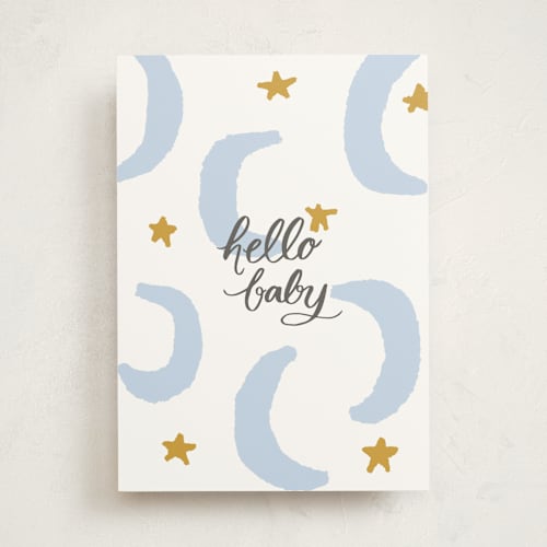 This is a baby blue new baby greeting cards with standard by Lea Velasquez called moon and stars printing on signature in greeting cards