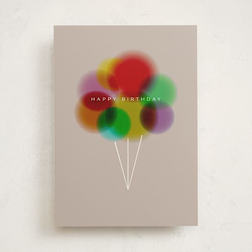 This is a beige birthday cards with standard by Lori Wemple called glow balloons printing on signature in greeting cards