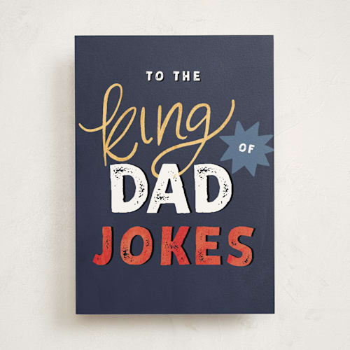 This is a navy fathers day cards with standard by Pixel and Hank called joke king printing on signature in greeting cards