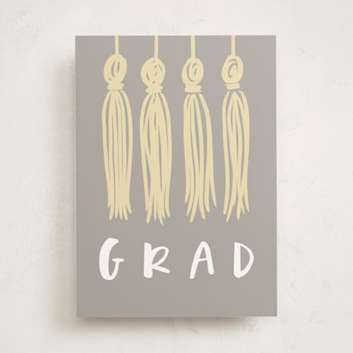 This is a slate graduation cards with standard by Angela Garrick called glitter tassels printing on signature in greeting cards