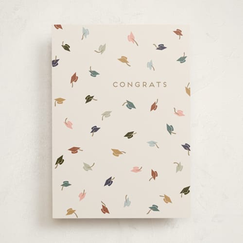 This is a cream graduation cards with standard by Gwen Bedat called congrats hats printing on signature in greeting cards