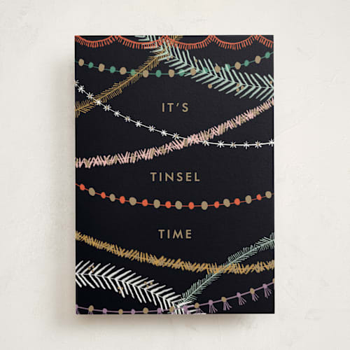 This is a midnight greeting cards with standard by Bethan called tinsel time printing on signature in greeting cards
