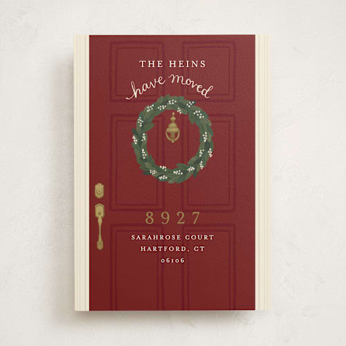 This is a deep red moving announcements with standard by Emily Hein called door wreath printing on signature in standard