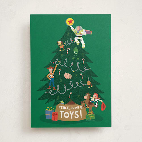 This is a christmas tree tbd with standard by Erica Krystek called peace, love & toys printing on signature in greeting cards