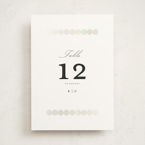 This is a silk table numbers with foil pressed by mo kelley called pearls printing on doublethick in standard
