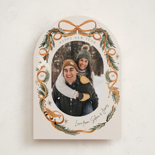 This is a cinnamon foil pressed holiday cards with foil pressed by Elly called winter ribbon printing on recycled smooth signature in standard