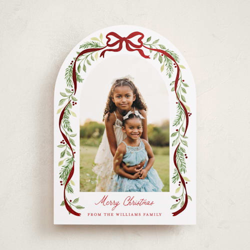 This is a cardinal foil pressed holiday cards with foil pressed by Sarah Knight called ribbon arch printing on recycled smooth signature in standard