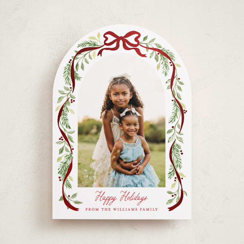 This is a cardinal foil pressed holiday cards with foil pressed by Sarah Knight called ribbon arch printing on recycled smooth signature in standard