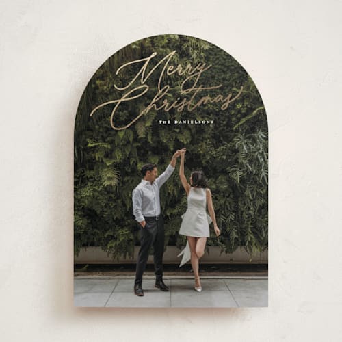 This is a snowfall foil pressed holiday cards with foil pressed by Melanie Kosuge called merry monoline printing on recycled smooth signature in standard