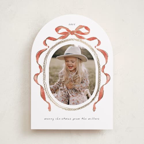 This is a pomegranate foil pressed holiday cards with foil pressed by Susan Zinader called whimsical bow printing on recycled smooth signature in standard