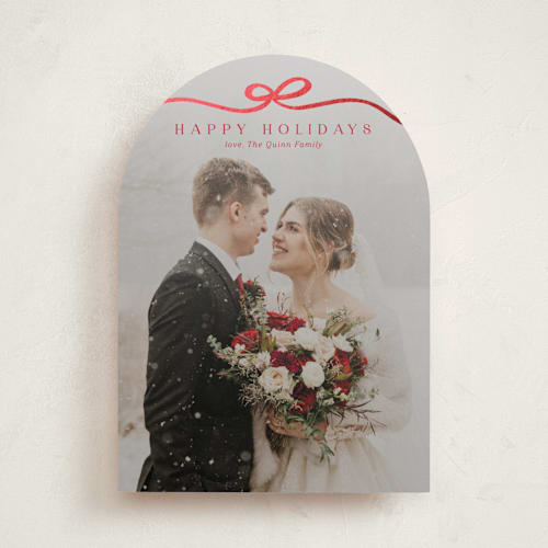 This is a cardinal foil pressed holiday cards with foil pressed by Kaydi Bishop called bow tied printing on recycled smooth signature in standard