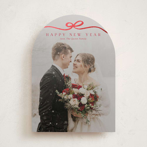 This is a cardinal foil pressed holiday cards with foil pressed by Kaydi Bishop called bow tied printing on recycled smooth signature in standard