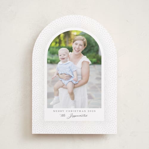 This is a snow gloss press holiday cards with gloss press by Kamala Nahas called frosted arch printing on recycled smooth signature in standard