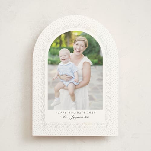 This is a snow gloss press holiday cards with gloss press by Kamala Nahas called frosted arch printing on signature in standard