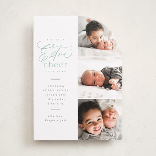 This is a mint babys first christmas with standard by Everett Paper Goods called extra cheer here printing on recycled smooth signature in standard