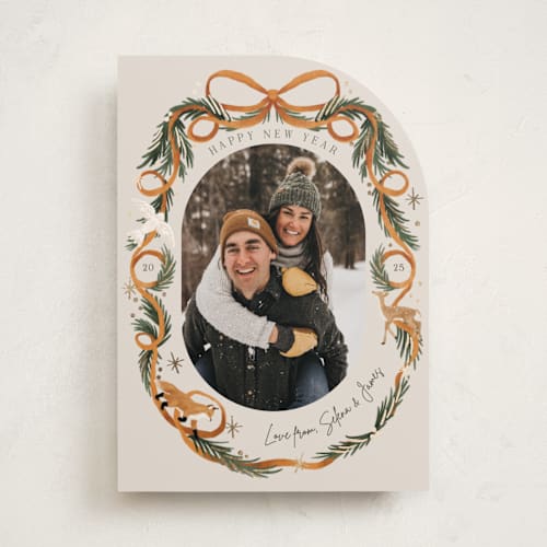 This is a cinnamon foil pressed holiday cards with foil pressed by Elly called winter ribbon printing on recycled smooth signature in standard