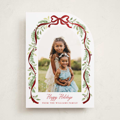 This is a cardinal foil pressed holiday cards with foil pressed by Sarah Knight called ribbon arch printing on recycled smooth signature in standard