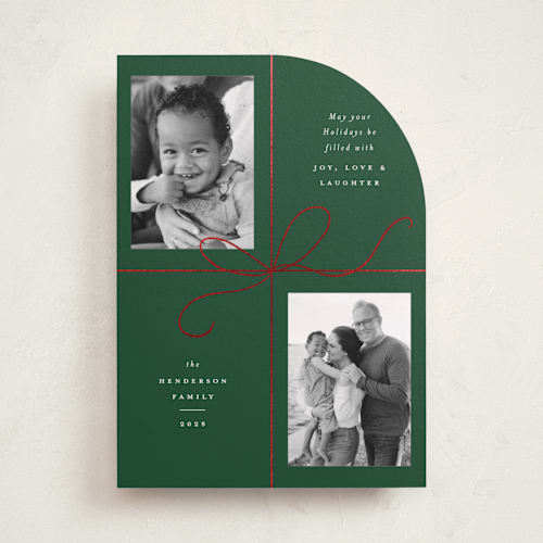 This is a holly foil pressed holiday cards with foil pressed by Emily Betts called bow two printing on recycled smooth signature in standard