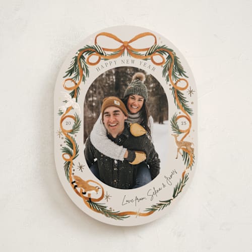 This is a cinnamon foil pressed holiday cards with foil pressed by Elly called winter ribbon printing on recycled smooth signature in standard