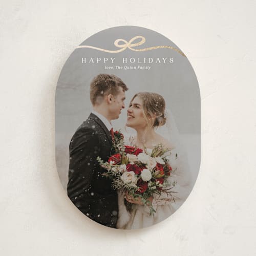 This is a snow foil pressed holiday cards with foil pressed by Kaydi Bishop called bow tied printing on recycled smooth signature in standard