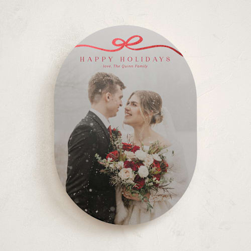 This is a cardinal foil pressed holiday cards with foil pressed by Kaydi Bishop called bow tied printing on recycled smooth signature in standard