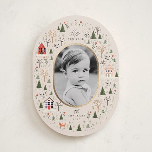 This is a taffy foil pressed holiday cards with foil pressed by Hannah Williams called winter village oval printing on recycled smooth signature in standard