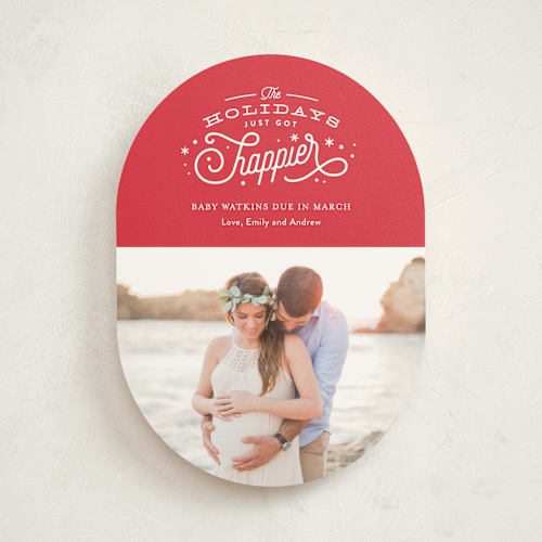 This is a poinsettia pregnancy announcements with standard by Jennifer Wick called happier holidays printing on signature in standard