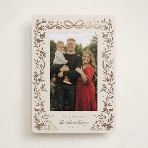 This is a buttercream foil pressed holiday cards with foil pressed by Kate Ahn called glittering garland printing on recycled smooth signature in standard