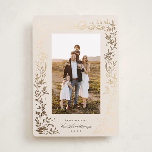 This is a buttercream foil pressed holiday cards with foil pressed by Kate Ahn called glittering garland printing on recycled smooth signature in standard