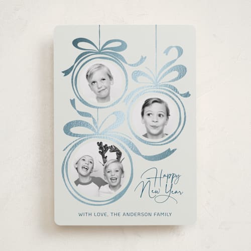 This is a snowball foil pressed holiday cards with foil pressed by Paper Sun Studio called baubles and bows printing on recycled smooth signature in standard