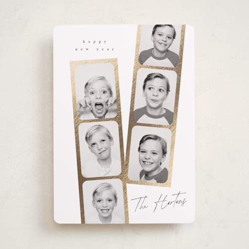 This is a snowfall foil pressed holiday cards with foil pressed by Leah Bisch called snapshots printing on recycled smooth signature in standard