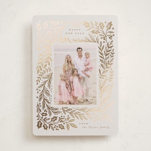 This is a buttercream foil pressed holiday cards with foil pressed by Alethea and Ruth called gilded forest printing on recycled smooth signature in standard
