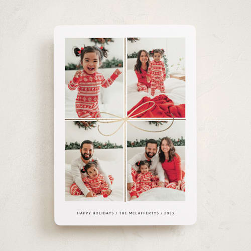 This is a snow foil pressed holiday cards with foil pressed by Laura Bercovich called all wrapped up printing on recycled smooth signature in standard