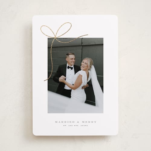 This is a winter foil pressed holiday cards with foil pressed by Yuliya Evseeva called little bow printing on recycled smooth signature in standard