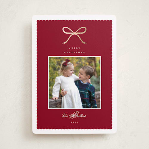 This is a cranberry foil pressed holiday cards with foil pressed by Emily Betts called scallop bow printing on recycled smooth signature in standard