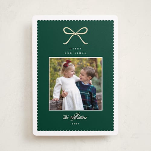 This is a pine foil pressed holiday cards with foil pressed by Emily Betts called scallop bow printing on recycled smooth signature in standard