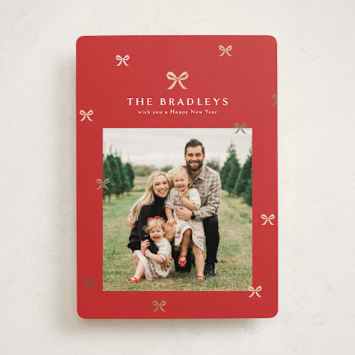 This is a cardinal foil pressed holiday cards with foil pressed by Melanie Kosuge called bow-tied printing on recycled smooth signature in standard