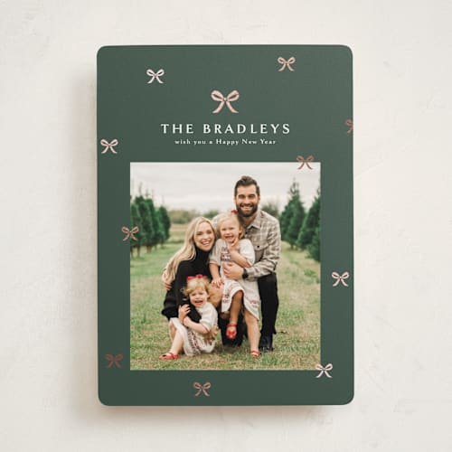 This is a evergreen foil pressed holiday cards with foil pressed by Melanie Kosuge called bow-tied printing on recycled smooth signature in standard