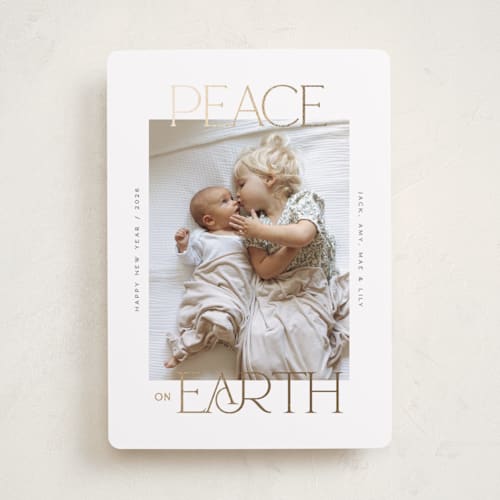 This is a snow foil pressed holiday cards with foil pressed by Owl and Toad called peace on earth sparkle printing on recycled smooth signature in standard