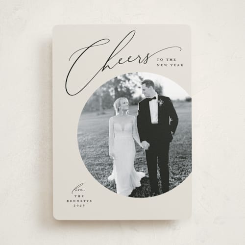 This is a vanilla new year photo cards with standard by Louise Kay called cheers script printing on recycled smooth signature in standard
