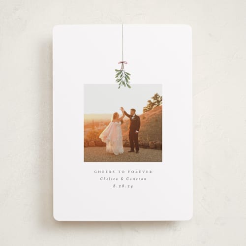 This is a winter holiday photo cards with standard by Randi Cirelli called married and merry printing on recycled smooth signature in standard