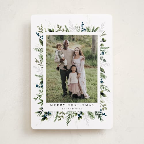 This is a winter berry holiday photo cards with standard by Susan Moyal called classic greenery printing on recycled smooth signature in standard