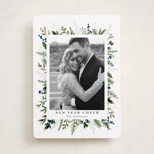 This is a winter berry holiday photo cards with standard by Susan Moyal called classic greenery printing on recycled smooth signature in standard