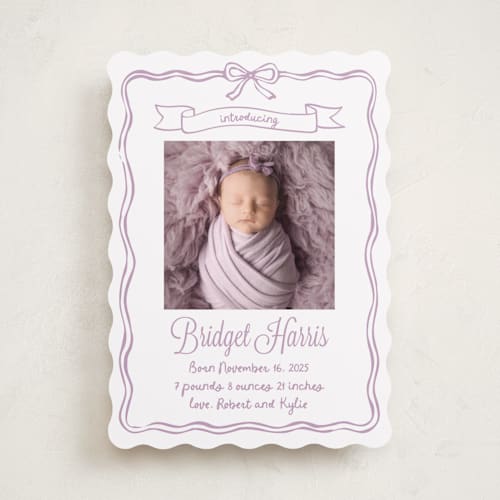 This is a lavander birth announcements with standard by Cass Loh called bow frame printing on smooth signature in standard