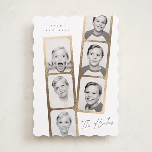 This is a snowfall foil pressed holiday cards with foil pressed by Leah Bisch called snapshots printing on recycled smooth signature in standard